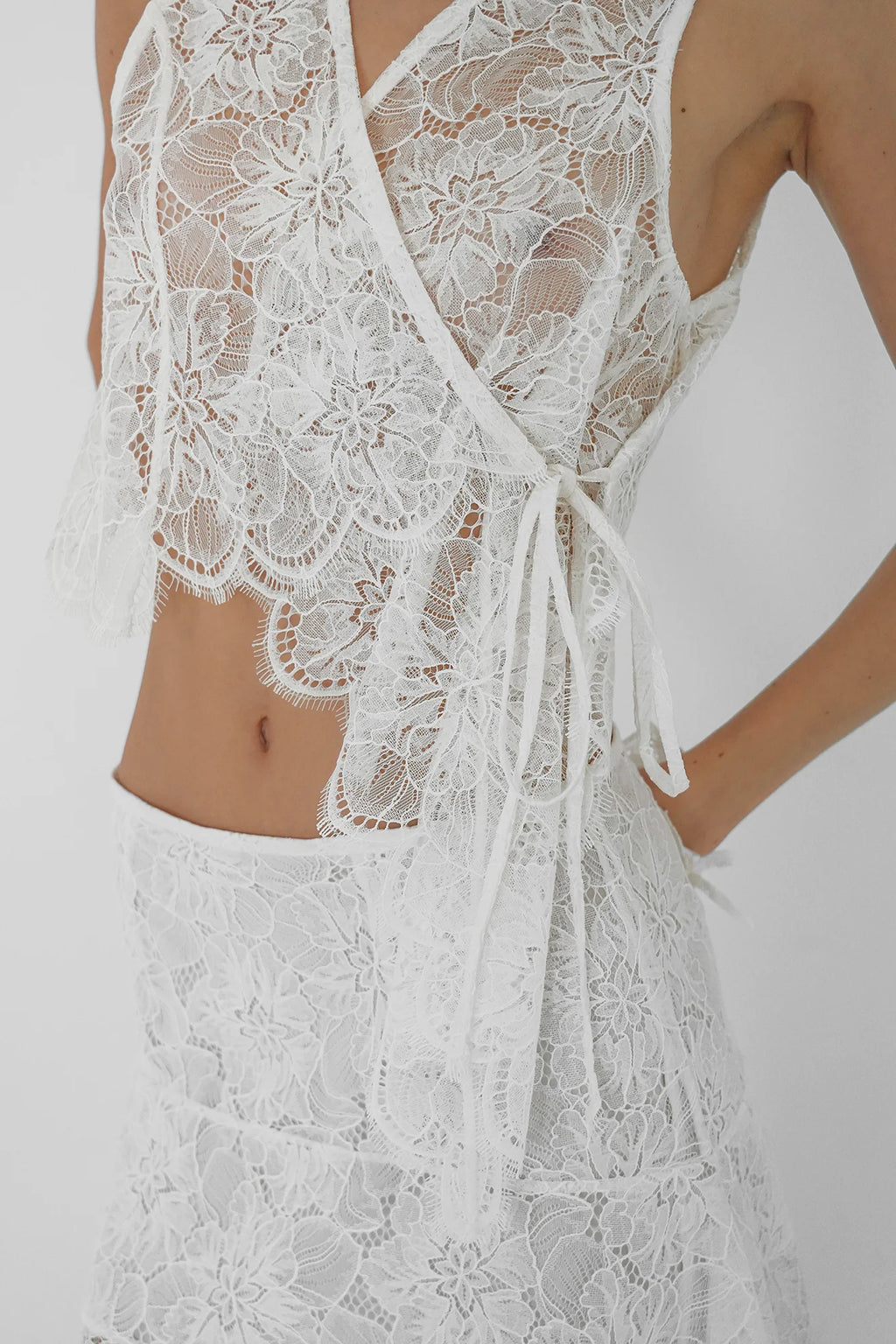 Asymmetrical lace vest